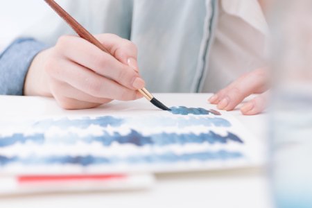 Child painting with paintbrush